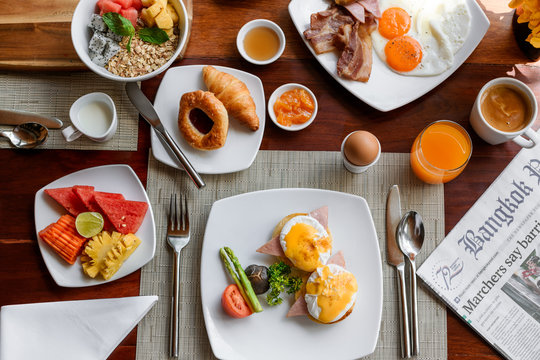 Setting of breakfast dishes in hotel restaurant