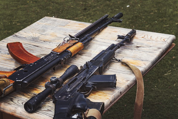 Arms trafficking. different rifles on the counter in the gun shop. clandestine sale of weapons....