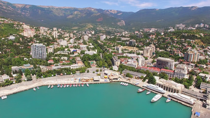 Fototapeta na wymiar Aerial photography of the seaside resort town by the sea.