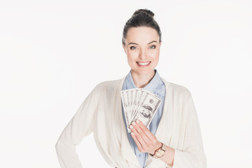 portrait of smiling woman holding dollar banknotes in hand isolated on white