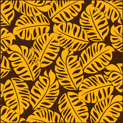 Fototapeta na wymiar Bright tropical design. On a dark brown background bright yellow tropical leaves.