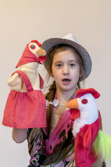 Happy child, creative fun concept - girl playing in the theater