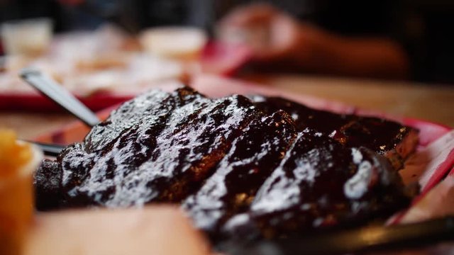 Marinated bbq ribs in a restaurant with sauce