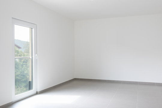 Empty room and white walls with window with a view