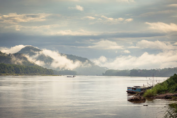 Row of tourist bungalows along Nam Song River in Vang Vieng, Vientiane Province, Laos. Vang Vieng is a popular destination for adventure tourism in a limestone karst landscape