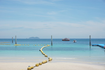 Floating buoys and Floating Pier Samae-San Island; Blue sea and blue sky with Beautiful  beach