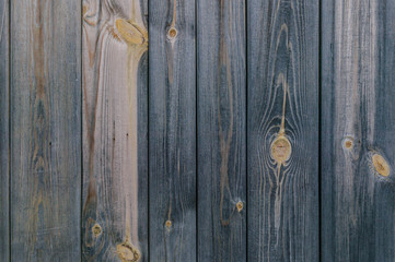 Vertical texture house wall of the old wooden boards. Rustic background