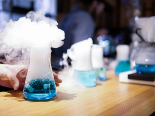 Bottle and liquid nitrogen. Chemical experiment