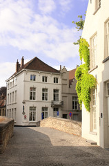 Fototapeta na wymiar Street with historic medieval buildings, Bruges, Belgium