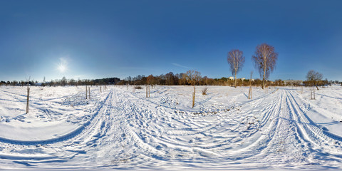 full seamless spherical panorama 360 by 180 degrees angle view on the snow covered field in sunny...