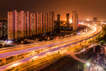 Fototapeta na wymiar Night Scene of Chinese City Environment with Apartment and Expressway