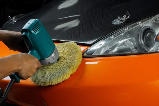 Car detailing series: Polishing orange sports car bumper