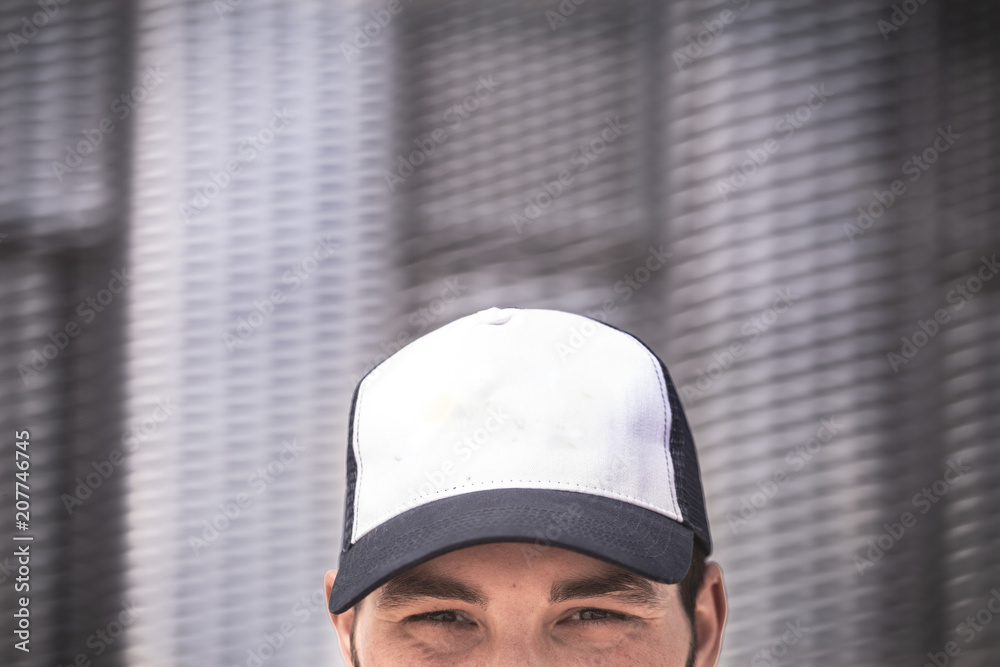 Wall mural portrait of young man with cap