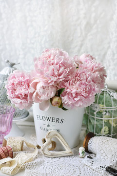 Fototapeta bunch of peony in shabby chic style interior