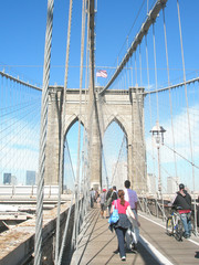 Brooklyn bridge and view of Manhattan and the city of New York on a sunny day