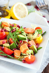 Healthy salad with papaya, avocado, tomatoes