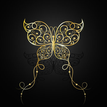 Gold butterfly with swirl pattern.