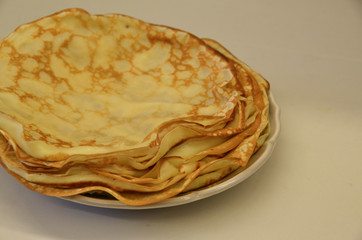 Blini. Tasty Russian pancakes on white table. Close up