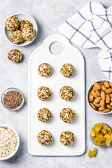 Raw vegan healthy dessert, date and nuts bliss balls, ingredients. Top view, space for text.