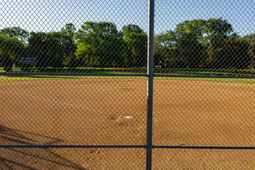 sitting in the spectators bleachers waiting for a game