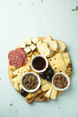 Assorted appetizers on desk. Cheeses, pate, honey, nuts