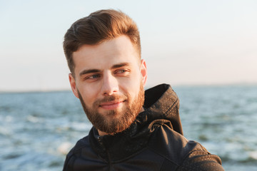 Close up portrait of a smiling young sportsman