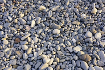 Fototapeta na wymiar Pebble stones on the beach in Nice, French Riviera, France
