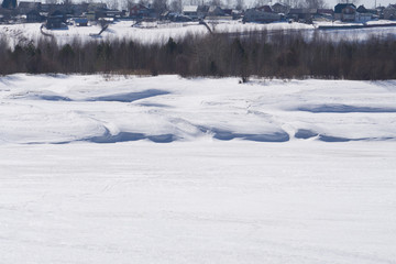 Old wooden house in a mountain village Morning twilight. Winter landscape with snow drifts. Color toning. Low contrast