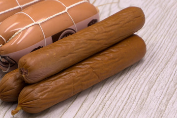 Fresh sausages with basil isolated on white background.