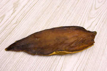 pieces smoked fish on a white background .