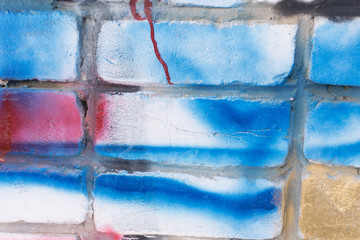 Cheerful young woman painting on the wall.