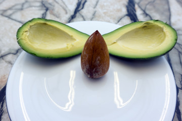 avocado on a dark wood background tinting selective focus