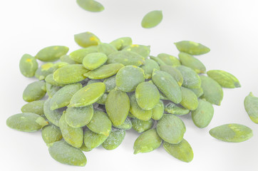Pumpkin seeds on a white background