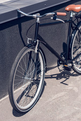 Naklejka na ściany i meble close up view of retro bicycle parked on street