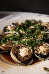 Steamed abalone dish at a chinese restaurant a very popular dish at asian wedding reception ceremonies