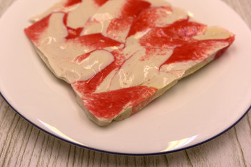 packing crab meat pressed briquette on a plate .
