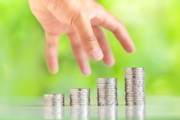 Money Collecting silver coins Adding money Men's hands are raising money Growing up of business nature background