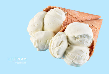 ice cream balls in a Waffle Cone on a Blue Background. Vanilla ice cream in a waffle cone.