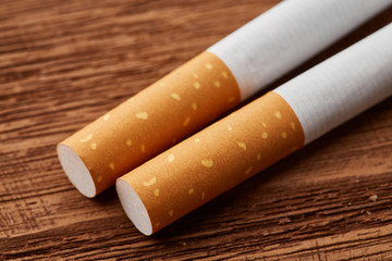 cigarettes close-up on a wooden background. Drug addiction. Smoking of tobacco. cancer. Nicotine. Bad habit.
