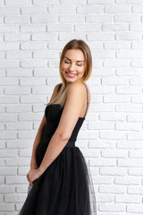 young woman posing in a lovely dress.