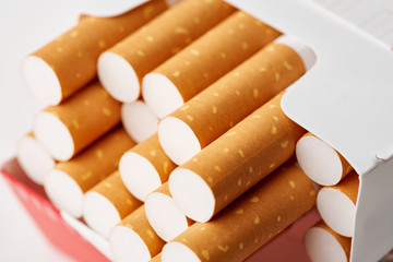 cigarettes in a pack close-up on a white background. Drug addiction. Smoking of tobacco. cancer. Nicotine. Bad habit.