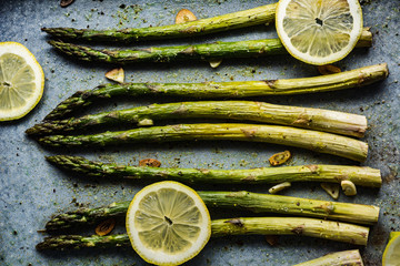 Roasted green asparagus with lemon, pepper, salt and garlic