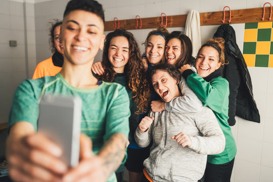 Football Players Taking Team Selfie In Changing Room