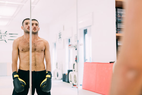 Mirror image portrait of boxer