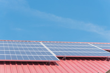 Close-up solar panel on metal roof of commercial building at Gainesville, TX, USA. Photovoltaic...