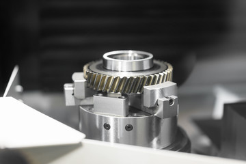 High precision CNC machining center working, operator machining and grinding automotive sample gear part process