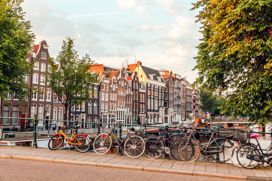 sunrise on the streets and canals of amsterdam
