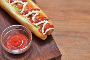 Hot dog with greenery with ketchup sauce