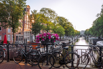 sunrise on the streets and canals of amsterdam