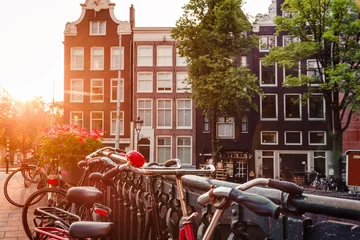 Foto op Aluminium sunrise on the streets and canals of amsterdam © MKavalenkau